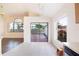 Eat-in kitchen with views of the living area, lanai access, and an additional window providing natural light at 8812 Beeler Dr, Tampa, FL 33626