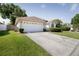 Charming one-story home with a two-car garage and well-maintained landscaping at 8812 Beeler Dr, Tampa, FL 33626