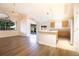 Bright open living and kitchen area with modern appliances, wood floors, and sliding door access to the lanai at 8812 Beeler Dr, Tampa, FL 33626
