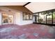 Spacious screened patio with brick flooring, offering easy indoor-outdoor flow at 8812 Beeler Dr, Tampa, FL 33626