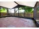 Enclosed brick patio with a screen, great for outdoor enjoyment and entertaining at 8812 Beeler Dr, Tampa, FL 33626