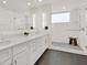 Modern bathroom with double sinks, white cabinets, a glass-enclosed shower, and sleek design at 920 N Osceola Ave # 301, Clearwater, FL 33755