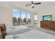 Bright bedroom with large windows, two beds, modern dresser, and scenic water views at 920 N Osceola Ave # 301, Clearwater, FL 33755