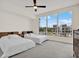 Spacious bedroom with two beds, large window offering a scenic view, and neutral decor at 920 N Osceola Ave # 301, Clearwater, FL 33755