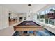 Game room with a billiard table, large windows, and modern lighting fixtures at 920 N Osceola Ave # 301, Clearwater, FL 33755