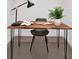Rustic home office setup, featuring a live edge wood desk, modern lamp, and stylish decor at 920 N Osceola Ave # 301, Clearwater, FL 33755