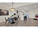 Open-concept kitchen and dining area with modern white cabinets and stainless appliances at 920 N Osceola Ave # 301, Clearwater, FL 33755