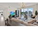 Bright living room featuring a comfortable sofa and balcony access at 920 N Osceola Ave # 301, Clearwater, FL 33755