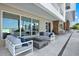 Outdoor patio seating area featuring comfortable seating, a fire pit, and views of the marina at 920 N Osceola Ave # 301, Clearwater, FL 33755