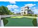 Community putting green, providing a recreational amenity with beautiful landscaping at 920 N Osceola Ave # 301, Clearwater, FL 33755