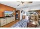 Open living space with dining area, modern entertainment center, and decorative rug at 9209 Seminole Blvd # 12, Seminole, FL 33772