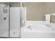 Bathroom featuring shower with glass door and a soaking tub at 10035 New Parke Rd, Tampa, FL 33626