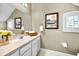 Upstairs bathroom featuring great lighting, a basket of towels, and crisp white paint at 10035 New Parke Rd, Tampa, FL 33626