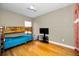 Bedroom with a bunk bed and plenty of space, illuminated by natural light at 10035 New Parke Rd, Tampa, FL 33626