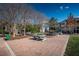 Outdoor ping pong table and seating area surrounded by lush greenery and mature trees at 10035 New Parke Rd, Tampa, FL 33626