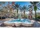 Charming community fountain surrounded by mature trees and well-maintained landscaping at 10035 New Parke Rd, Tampa, FL 33626