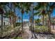 Community fountain viewed through lush foliage with trees lining a brick pathway at 10035 New Parke Rd, Tampa, FL 33626