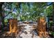 Brick walkway and entrance to the community fountain and seating area surrounded by mature trees at 10035 New Parke Rd, Tampa, FL 33626