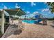 Community pool includes a waterslide, lounge seating, and a shaded pavilion for a relaxing poolside experience at 10035 New Parke Rd, Tampa, FL 33626