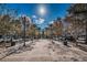 Inviting community space featuring a brick walkway, benches, and mature trees for a relaxed atmosphere at 10035 New Parke Rd, Tampa, FL 33626