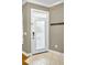 Bright entryway featuring tile flooring and coat hooks at 10035 New Parke Rd, Tampa, FL 33626