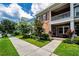 Charming two-story townhome with brick facade, balcony and well manicured lawn at 10035 New Parke Rd, Tampa, FL 33626
