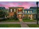 Charming two-story townhome with brick facade, balcony and lush landscaping at 10035 New Parke Rd, Tampa, FL 33626