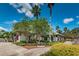 Community office building showcasing mature landscaping, palm trees, and an inviting exterior at 10035 New Parke Rd, Tampa, FL 33626