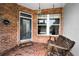 Charming front porch with brick flooring and swing at 10035 New Parke Rd, Tampa, FL 33626