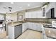 Charming kitchen with granite counters, white cabinets, and stainless-steel dishwasher at 10035 New Parke Rd, Tampa, FL 33626