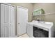 Laundry room featuring modern, efficient washer and dryer units with ample storage at 10035 New Parke Rd, Tampa, FL 33626