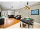 Cozy living room with dining area, leather sofas, and ample natural light at 10035 New Parke Rd, Tampa, FL 33626