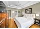 Spacious main bedroom boasts tray ceiling, hardwood floors, and a large window at 10035 New Parke Rd, Tampa, FL 33626