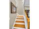 Bright stairway with wood steps, white risers and handrail at 10035 New Parke Rd, Tampa, FL 33626