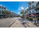 Charming street view with boutiques, apartments, and coffee shops under a sunny sky, promoting a vibrant community at 10035 New Parke Rd, Tampa, FL 33626