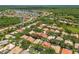 Scenic aerial view of a community with lush greenery, lakes, and well-maintained homes, creating a serene and desirable neighborhood at 10229 Waterside Oaks Dr, Tampa, FL 33647