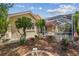 A charming backyard view features lush landscaping, a patio, and a screened-in porch for relaxation and outdoor enjoyment at 10229 Waterside Oaks Dr, Tampa, FL 33647