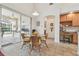 Dining area with tile floors, patio access, and built in desk at 10229 Waterside Oaks Dr, Tampa, FL 33647