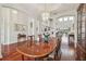 Elegant dining room featuring hardwood floors, high ceilings, and a large table at 10229 Waterside Oaks Dr, Tampa, FL 33647