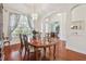 Formal dining room with a chandelier, hardwood floors, and elegant decor at 10229 Waterside Oaks Dr, Tampa, FL 33647