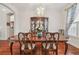 Elegant dining room featuring a wood table, chandelier, and china cabinet, perfect for Gathering meals at 10229 Waterside Oaks Dr, Tampa, FL 33647