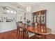 Formal dining room with hardwood floors, chandelier, and built in china cabinet at 10229 Waterside Oaks Dr, Tampa, FL 33647
