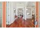 Bright foyer featuring hardwood floors, high ceilings, and views into the living spaces at 10229 Waterside Oaks Dr, Tampa, FL 33647