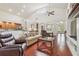Open-concept living room with a vaulted ceiling, hardwood floors, and seamless access to the kitchen at 10229 Waterside Oaks Dr, Tampa, FL 33647