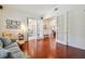 Living room with french doors, hardwood floors and neutral colored furniture at 10229 Waterside Oaks Dr, Tampa, FL 33647