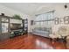 Living room with hardwood floors, television and entertainment center at 10229 Waterside Oaks Dr, Tampa, FL 33647
