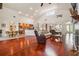 Bright and airy living room with hardwood floors, ceiling fans, and easy access to the kitchen at 10229 Waterside Oaks Dr, Tampa, FL 33647