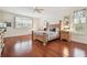 Spacious main bedroom with hardwood floors, high ceilings, and natural light at 10229 Waterside Oaks Dr, Tampa, FL 33647