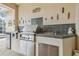 Outdoor built in grill with stainless steel drawers and tiled counter at 10229 Waterside Oaks Dr, Tampa, FL 33647