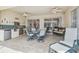 Outdoor patio with a built in grill, tile floors, and ceiling fans at 10229 Waterside Oaks Dr, Tampa, FL 33647